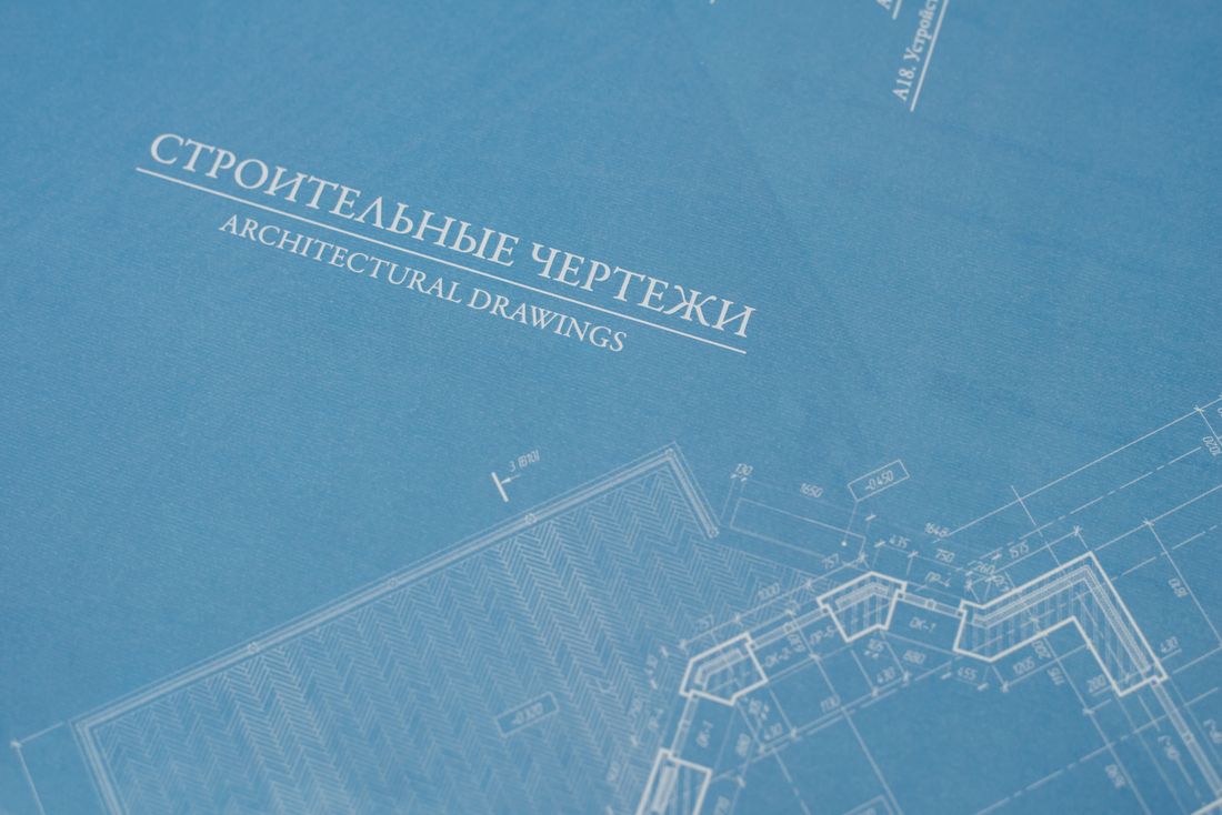 RICS surveyor reviewing building plans