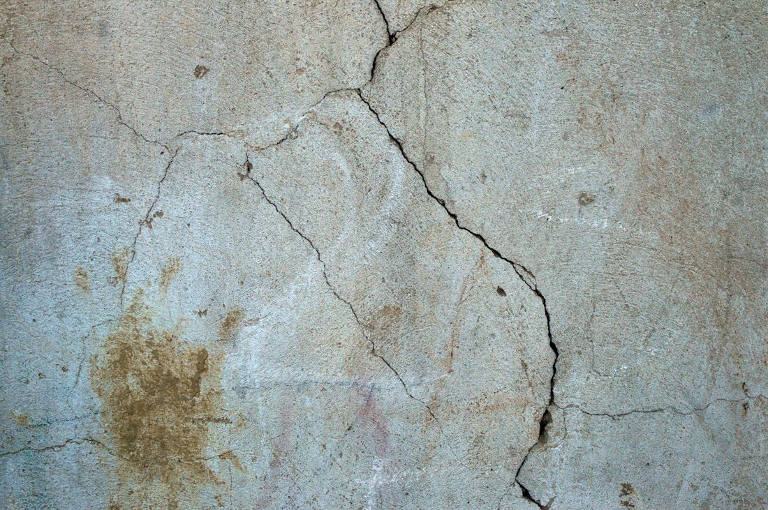 Surveyor investigating a specific defect inside a home