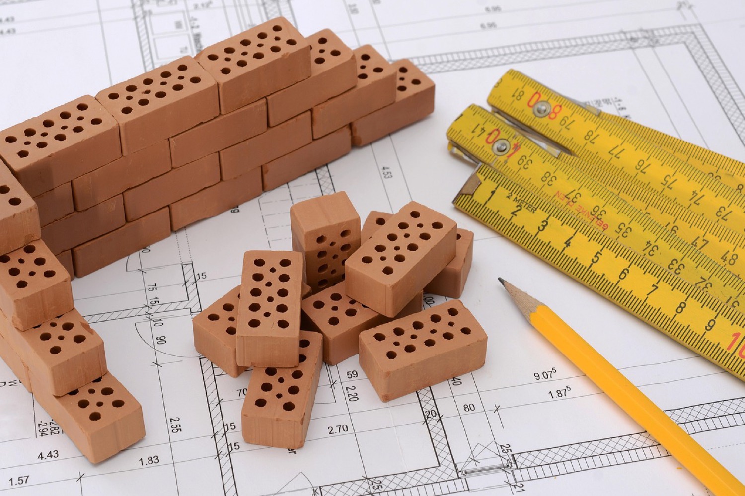 RICS surveyor reviewing building plans